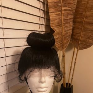 High bun lace wig color off black with adjustable strap.